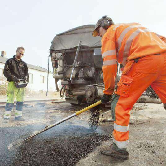 royal-paving-manual-workers-paving-at-road-construction-site